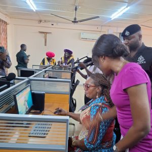 Eastern Regional Minister, Hon. Rita Akosua Adjei Awatey, exploring one of the newly installed computers in the Digital Education lab at PWCE,