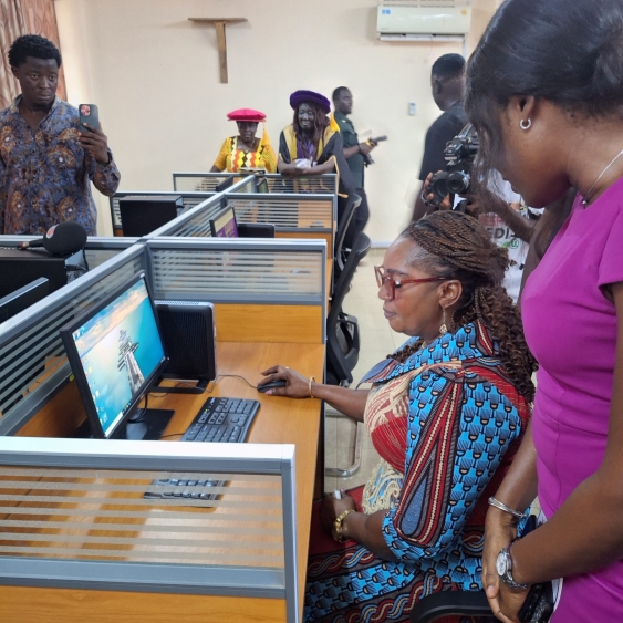 Eastern Regional Minister, Hon. Rita Akosua Adjei Awatey, exploring one of the newly installed computers in the Digital Education lab at PWCE,
